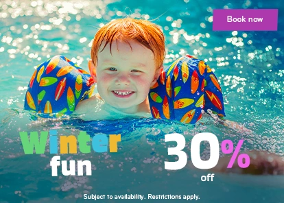 Winter vacation offer with 30% discount featuring a toddler with floaties in the pool.